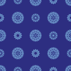 Winter abstract drawing. New Year's background. Snowflakes in blue. Seamless pattern.