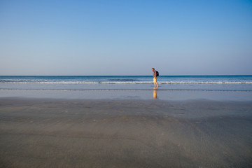 Obraz premium copy space caucasian man training on the beach in morning. Young fitness male on morning run outdoors copyspace sky, sea landscape.healthy way,cardio and detox