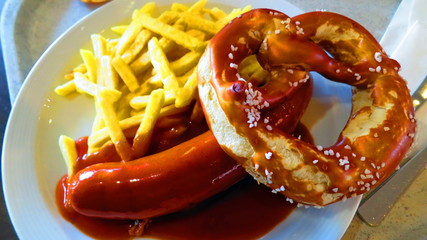 German food: sausage, french fries, pretzel