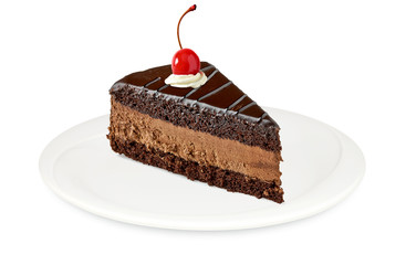 Chocolate or devils cake slice with maraschino cherry in dish or plate isolated on white background