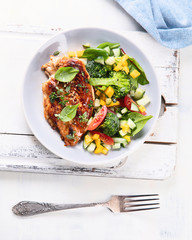 Chicken breast with fresh vegetable salad