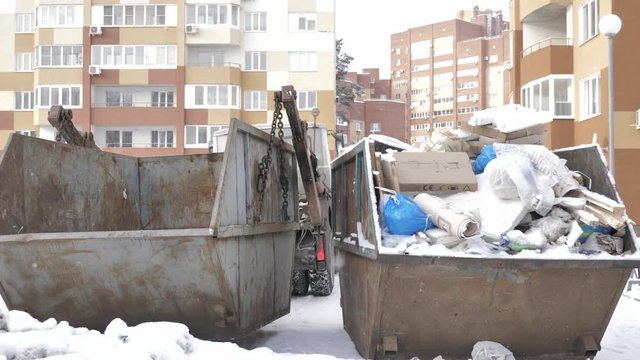 Garbage truck in the yard take out trash and waste