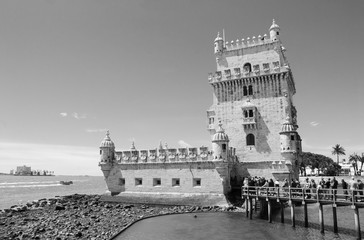 Belem tower and tourists waiting in line. Lisbon, Portugal. Black and white.