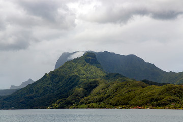 Huahine island overgrown with rainforest in Pacific ocean in the Leeward group of the Society...