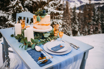 Wedding cake on a elegant table with serving