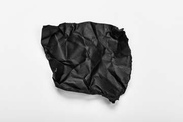 close up of a crumpled paper with curled edge on white background