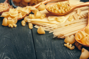 Various pasta on spoons