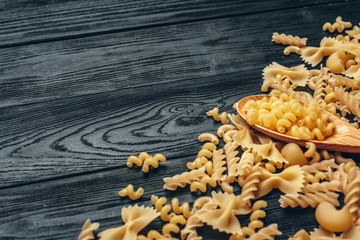 Various pasta on spoons