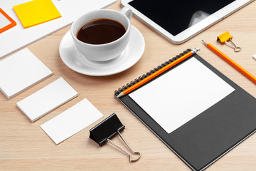 Corporate identity design template on wooden desk close up