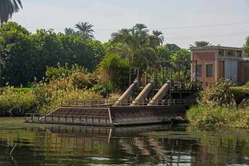 Fototapeta premium Landscape view of large pumping station on river nile in Egypt
