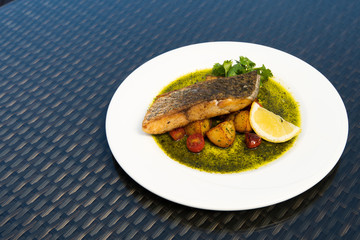 Deep Fried Salmon Seabass fish cut meat with fried potato chip, Fusion food stylish arrange on glass table along ocean mangrove tree Island, empty copy space for text logo Yummy