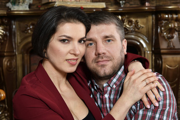 Close up portrait of happy beautiful young couple hugging