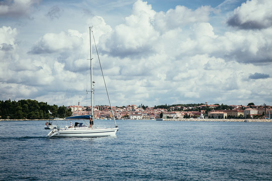 Sail boat and clear blue water in a Croatian bay, golden cape