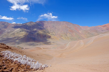 Ice or snow penitentes and andean landscape at Paso De Agua Negra mountain pass, Chile and Argentina, South America - obrazy, fototapety, plakaty