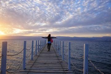 Fototapeta premium girl on the catwalk at sunset