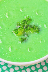 Bowl of cream of broccoli soup. Top view. Concept of healthy eating or vegetarian food