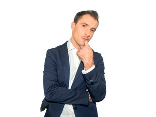 Portrait of  determined  male  touching chin while thinking and looking with serious and worried look at camera, Isolated on a white background.
