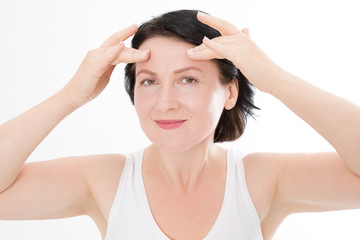 Fototapeta premium Macro Woman face with wrinkles on the forehead. Collagen and face injections concept. Menopause. Cropped image. Copy space and mock up. Plastic surgery