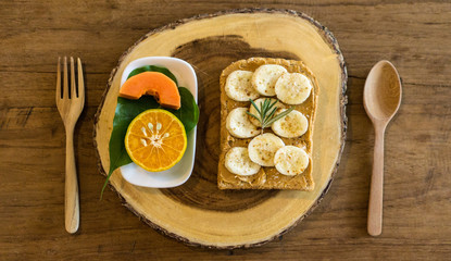 breakfast with banana peanut butter toast and fruits