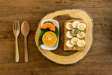 breakfast with banana peanut butter toast and fruits