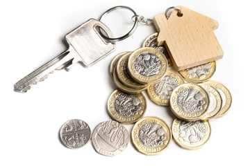 House key on key chain with UK money