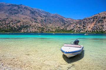 Boat on a lake Kournas at Crete island. Greece
