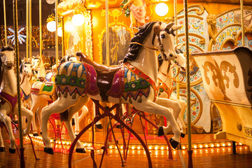 Fototapeta na wymiar Ancient German Horse Carousel built in 1896 in Navona Square, Rome, Italy