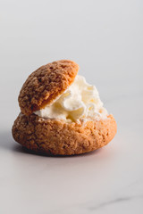 close up of sweet oatcake with whipped cream