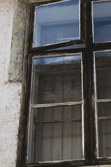 Fototapeta na wymiar Glass window of old house in Central Europe