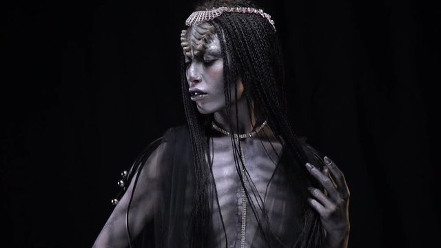 Woman with a gray skin like an alien
