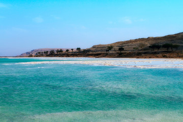 Fototapeta na wymiar Crystal sal beach on Dead Sea coast, Israel. The Dead Sea surface and shores are 430.5 m below sea level.