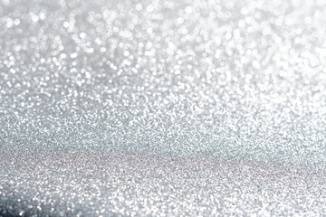 Obraz premium Silver and white glitter abstract bokeh background Christmas