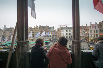 Fototapeta na wymiar Christmas square Grote Markt with Christmas market and ice skate ring in Bruges.