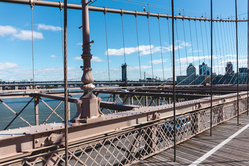 Fototapeta premium brooklyn bridge on blue sky and manhattan on background, new york, usa