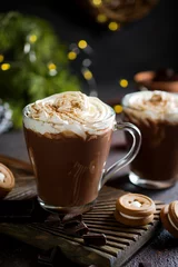 Foto op Plexiglas Traditional winter dishes. Traditional drink  Christmas or New Year. Mug of  hot and spicy aromatic chocolate with whipped cream on top. © Iryna