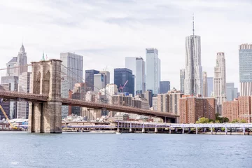 Fotobehang New York urban scene with brooklyn bridge and manhattan in new york, usa  © LIGHTFIELD STUDIOS