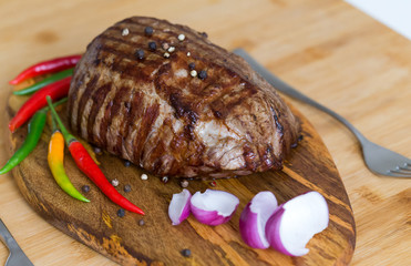 Food. Steak filet mignon, decorated chili and onions