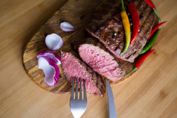 Food. Steak filet mignon, decorated chili and onions