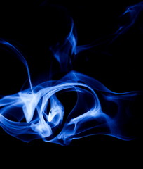 Blue smoke on black background