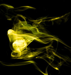 Yellow smoke on black background