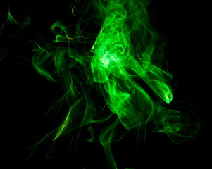 Green smoke on black background
