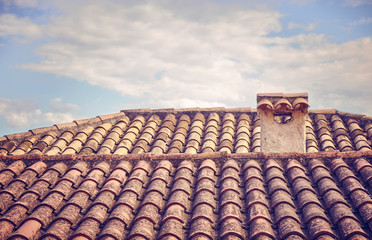 Old ceramic tile roof, selective focus, color toning applied, Mallorca, Spain.