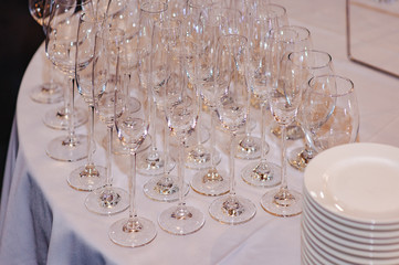 Wine glasses in a restaurant setting. Serving on the table. Crystal glasses for catering