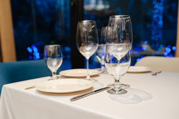 Wine glasses in a restaurant setting. Serving on the table. Crystal glasses for catering