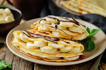 Crepes with fresh banana slaces and dark chocolate