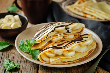 Crepes with fresh banana slaces and dark chocolate