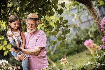 Grandparent with his grandchild spending time together in countryside