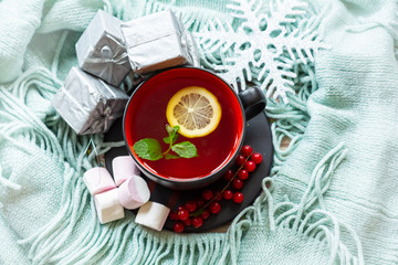 A Cup of hot tea in a Christmas setting
