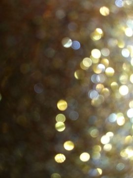 graduated gold glitter blur abstract background