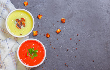 Variety of colorful vegetables cream soups and ingredients for soup. Top view. Concept of healthy eating or vegetarian food.